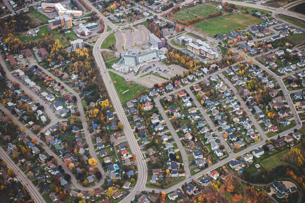 an aerial view of a city with lots of houses
