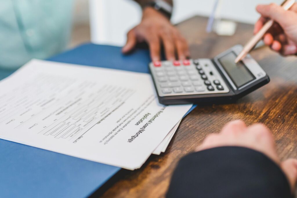 real estate agent calculating an amount to a client
